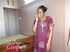 Foxy Indian babe posing in her pink, blue and white dress before she opens
