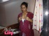 Foxy Indian babe posing in her pink, blue and white dress before she opens