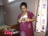 Foxy Indian babe posing in her pink, blue and white dress before she opens