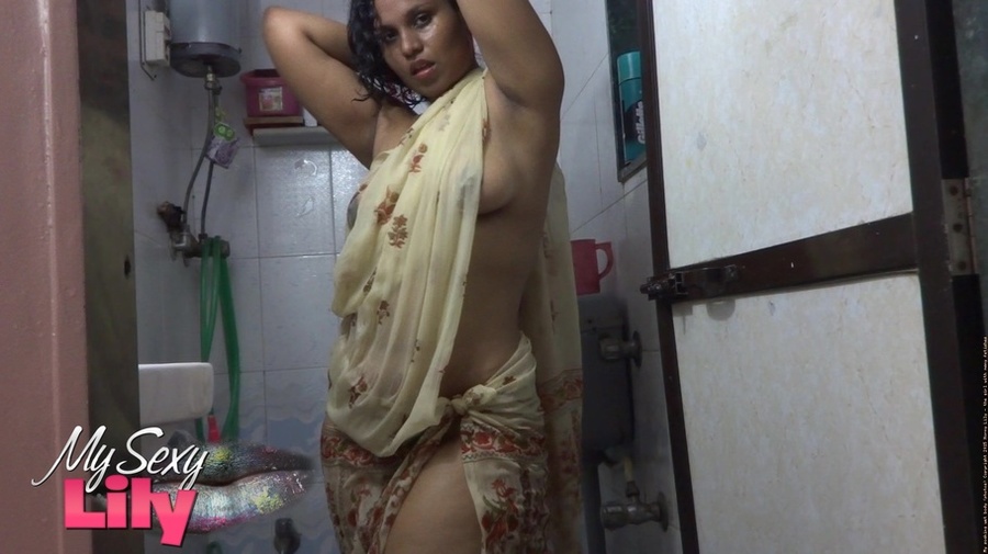 Indian hottie wraps herself with her white and brown shawl then gets her body wet as she takes a shower before she reveals her luscious soft breasts in the bathroom. - XXXonXXX - Pic 1