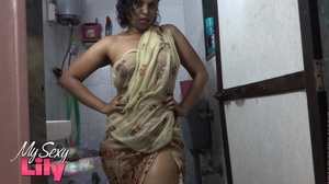 Indian hottie wraps herself with her white and brown shawl then gets her body wet as she takes a shower before she reveals her luscious soft breasts in the bathroom. - Picture 3