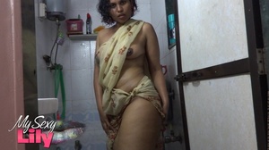 Indian hottie wraps herself with her white and brown shawl then gets her body wet as she takes a shower before she reveals her luscious soft breasts in the bathroom. - Picture 7