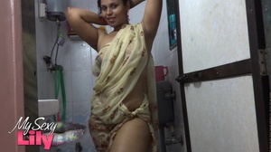 Indian hottie wraps herself with her white and brown shawl then gets her body wet as she takes a shower before she reveals her luscious soft breasts in the bathroom. - Picture 8