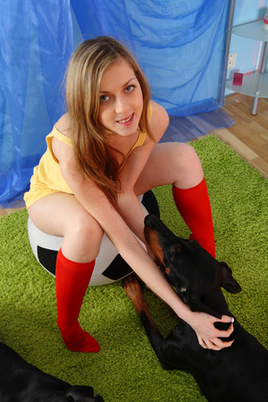 Pretty teen in sexy yellow nighty and red socks pets her dogs before she sucks her big red dildo then shoves it in her lusty wet pussy on a green carpet. - XXXonXXX - Pic 2