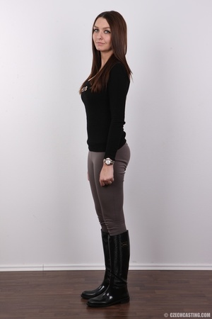Alluring wench in a black top, grey pant - Picture 3