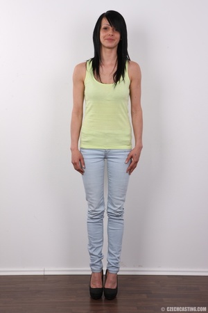 Alluring dame in a green top, faded jean - Picture 2