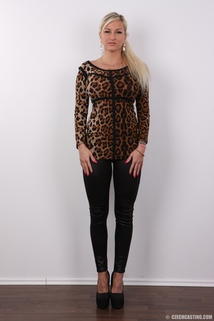 Enticing woman in a leopard print top an - Picture 2