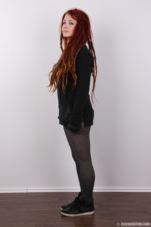Enthralling redhead miss in a black top  - Picture 3