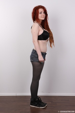 Enthralling redhead miss in a black top  - Picture 5