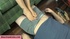 Blonde with pigtails presses masked man's cock with her feet