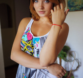 Marvelous harlot in a printed white shirt and white panties presents her