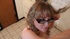 Hot babe with black glasses puts on her make up in white nighty with pink