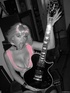 Pipping-hot busty bimbo enjoys playing sexy les paul guitar