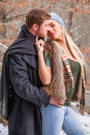 Hot blonde tranny wearing green shirt, brown scarf, boots, blue bonnet and pants displays her banging body with her hot boyfriend.