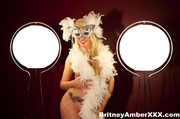 Tempting blonde in white net pantyhose and facemask display hot ass and big tits
