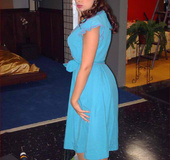 Lovely brunette girl in ponytail and blue dress gets nude to dance at