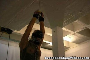 Tied and bondaged slave wears latex mask - Picture 3