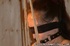 Brunette woman in black stockings gets tits bondaged