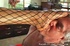 Red-haired Ebony in fishnet bodystocking gives feet for licking