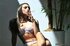 Passionate brunette teeny smoking a cigarette with style