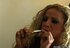 Curly haired blonde slut loves to smoke so much