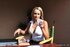 Elegant blonde darling shows her legs and smokes a cigarette