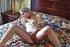 Hot young slut shows her body and smokes in her bed