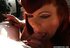 Redhead gives a nice blowjob and smokes a cigarette