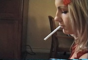 Cute blonde slut sucks a dick and smokes a cigarette