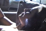 Beautiful lady displays her body and puffs on a cigarette