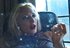 Mean blonde bitch shows her tits and smokes a cigarette