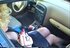 Horny blonde darling smokes a cigarette in her car