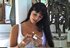 Raven haired cutie is a passionate smoker with a natural body