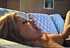 Hot darling lays on her couch and puffs on a cigarette