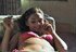 Hottie chills on her couch and puffs a cigarette