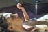 Hottie chills on her couch and puffs a cigarette