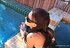 Hot slut with glasses smokes by the pool with pleasure