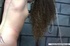 Curly-haired babe enjoys every second of being bondaged