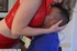 Hot bitch in red costume dominates poor bondaged boy