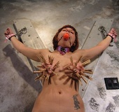 Bound bitch shows her impressive titties and gets teased