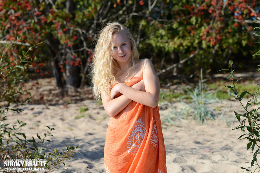Foxy blonde teases as she slowly peels off her mini white dress then bares her skinny body with small tits and sweet pussy while she sits naked on a big boulder at the beach. - XXXonXXX - Pic 17