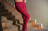 Dark-haired babe shows her butt and pussy on the stairs