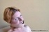 Amateur girl sits on the chair of lust and pain