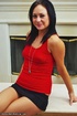 Pretty dark-haired chick exposes her seductive forms