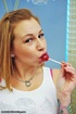 Inked babe with lollipop and big tits gives footjob