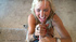 Foxy blonde cougar shows her giant boobs wearing her black dress, stockings