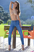 Petite sex model undresses outdoors for your pleasure