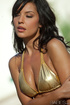 Brunette cover girl poses by the poolside for her fans