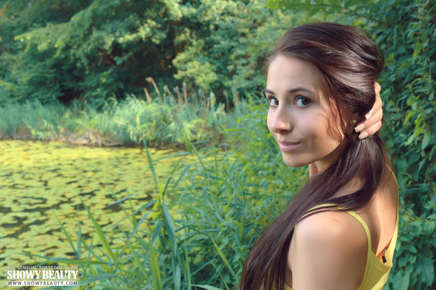 Gorgeous young chick with luscious thin body removes her yellow shirt and bares her hot boobs before she shows her crack in different positions while she pose naked by the lake. - XXXonXXX - Pic 2