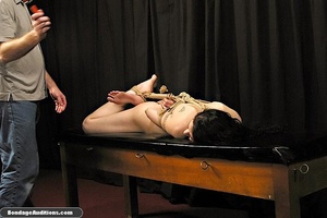 Dark haired lady gets hogtied and teased - Picture 3
